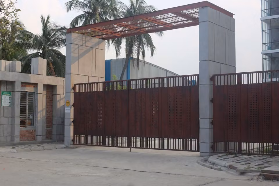 Automated iron security gate at a commercial entrance